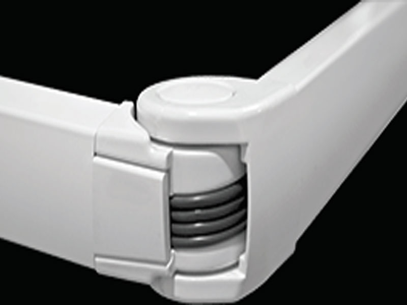 Dual-cable support arms on a Sunesta retractable awning during installation on a Kansas City home